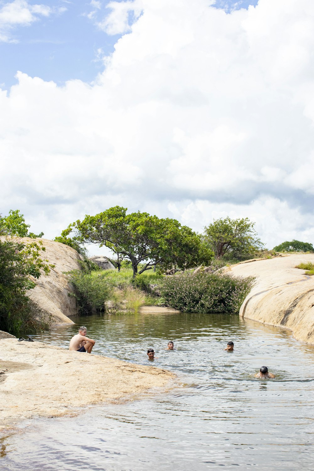 a group of people swimming in a body of water