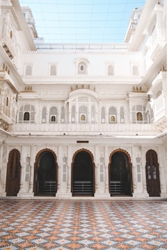 a large white building with a checkered floor