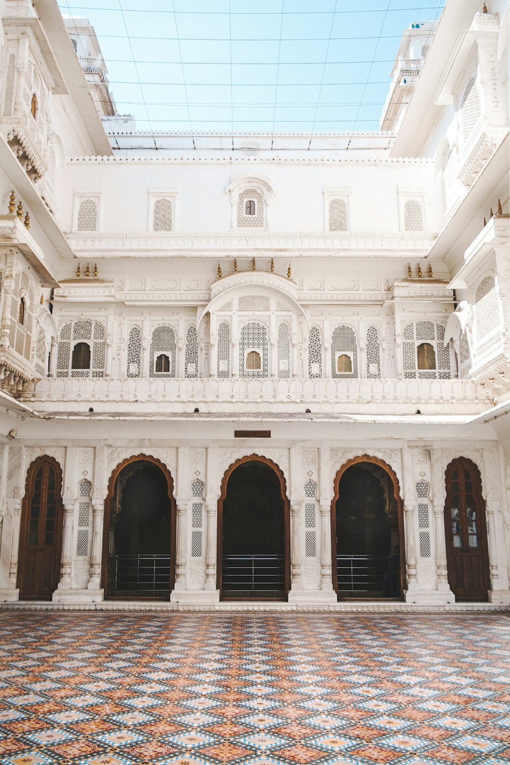 a large white building with a checkered floor