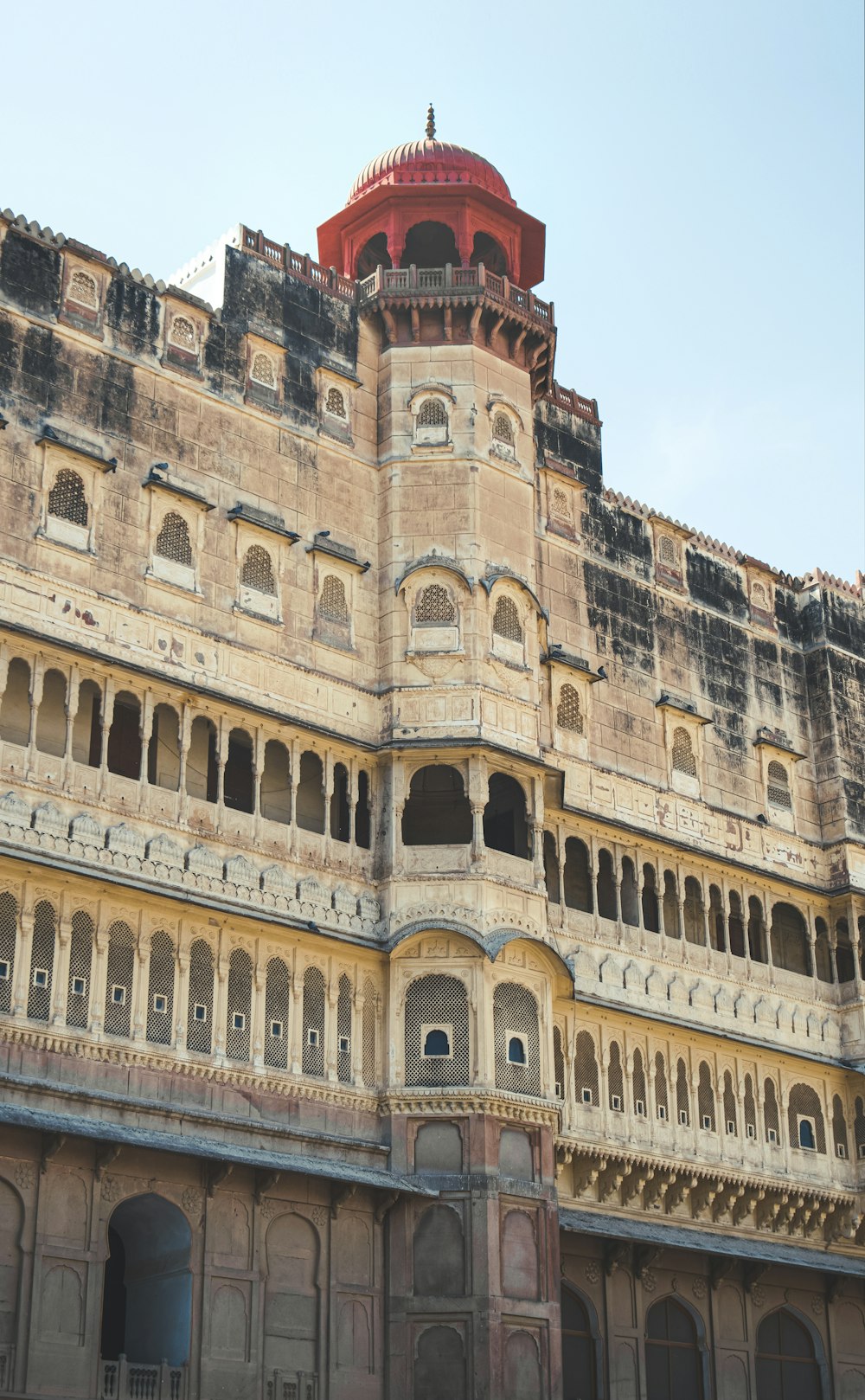 a large building with a red dome on top of it