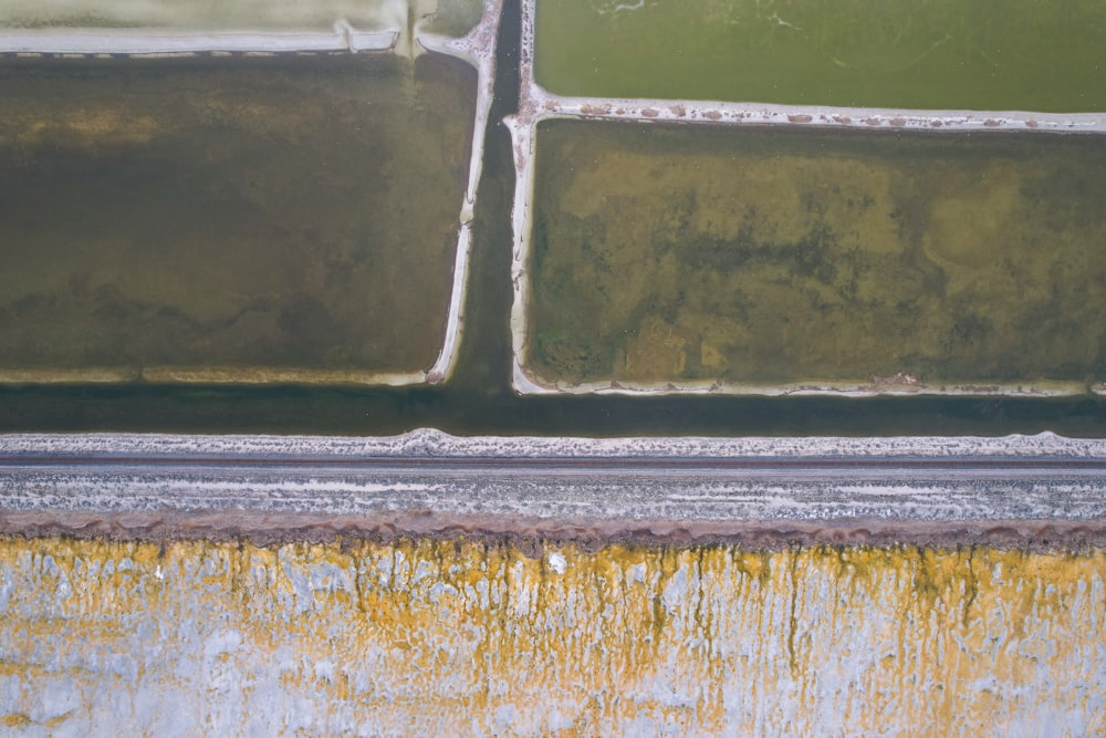 a close up of a window with a rusted metal frame