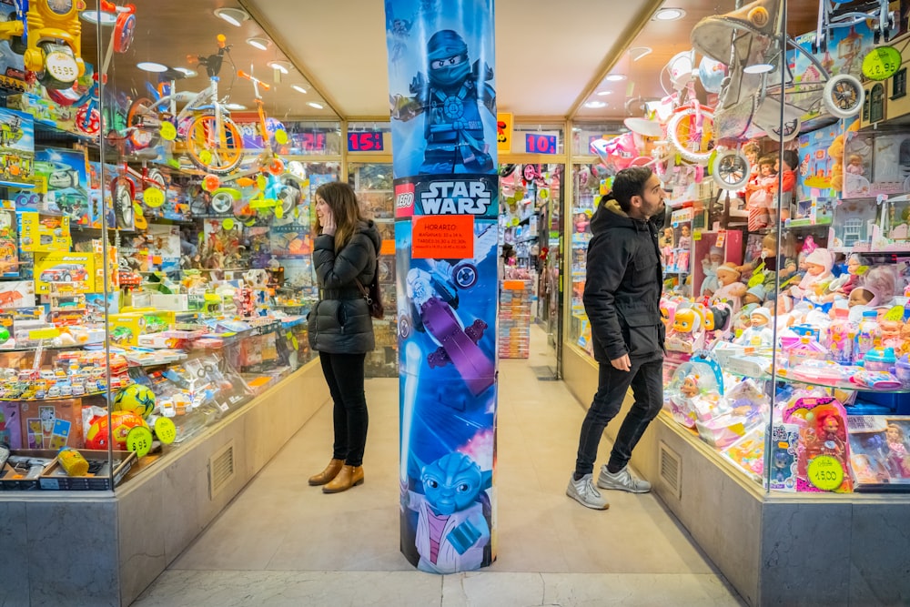 a couple of people that are standing in a store