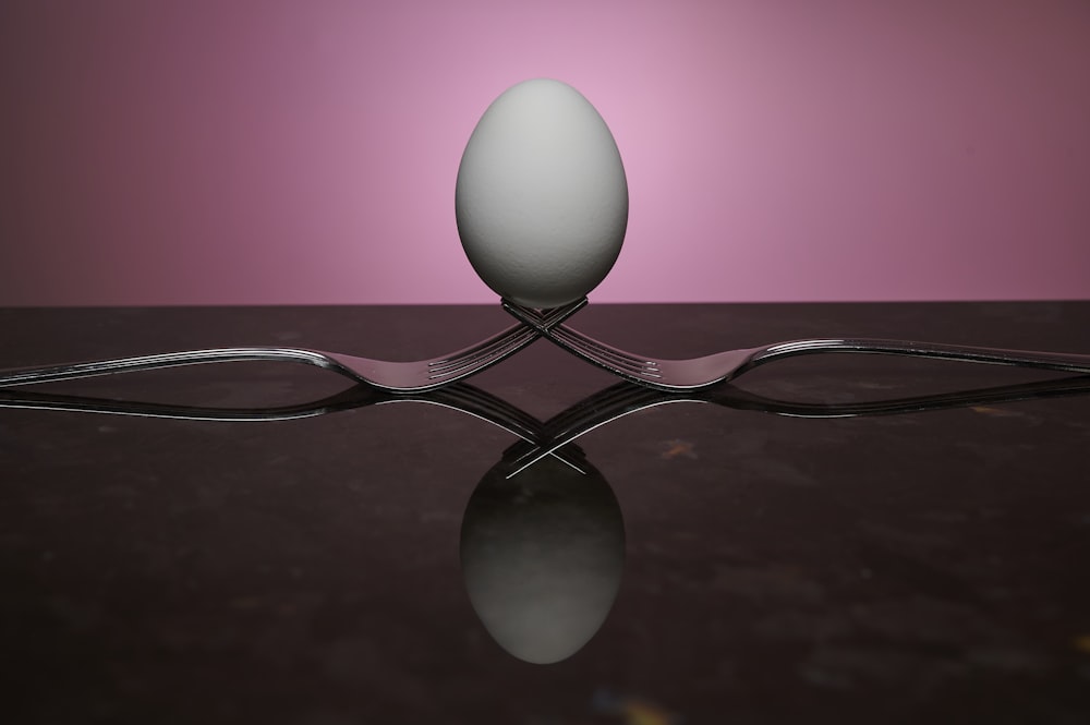 a fork and an egg on a table