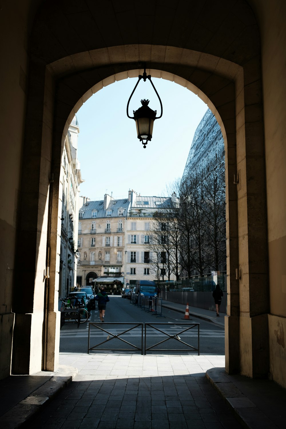 a street with a light hanging from the side of it