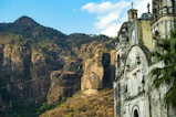 a church in the middle of a mountain range