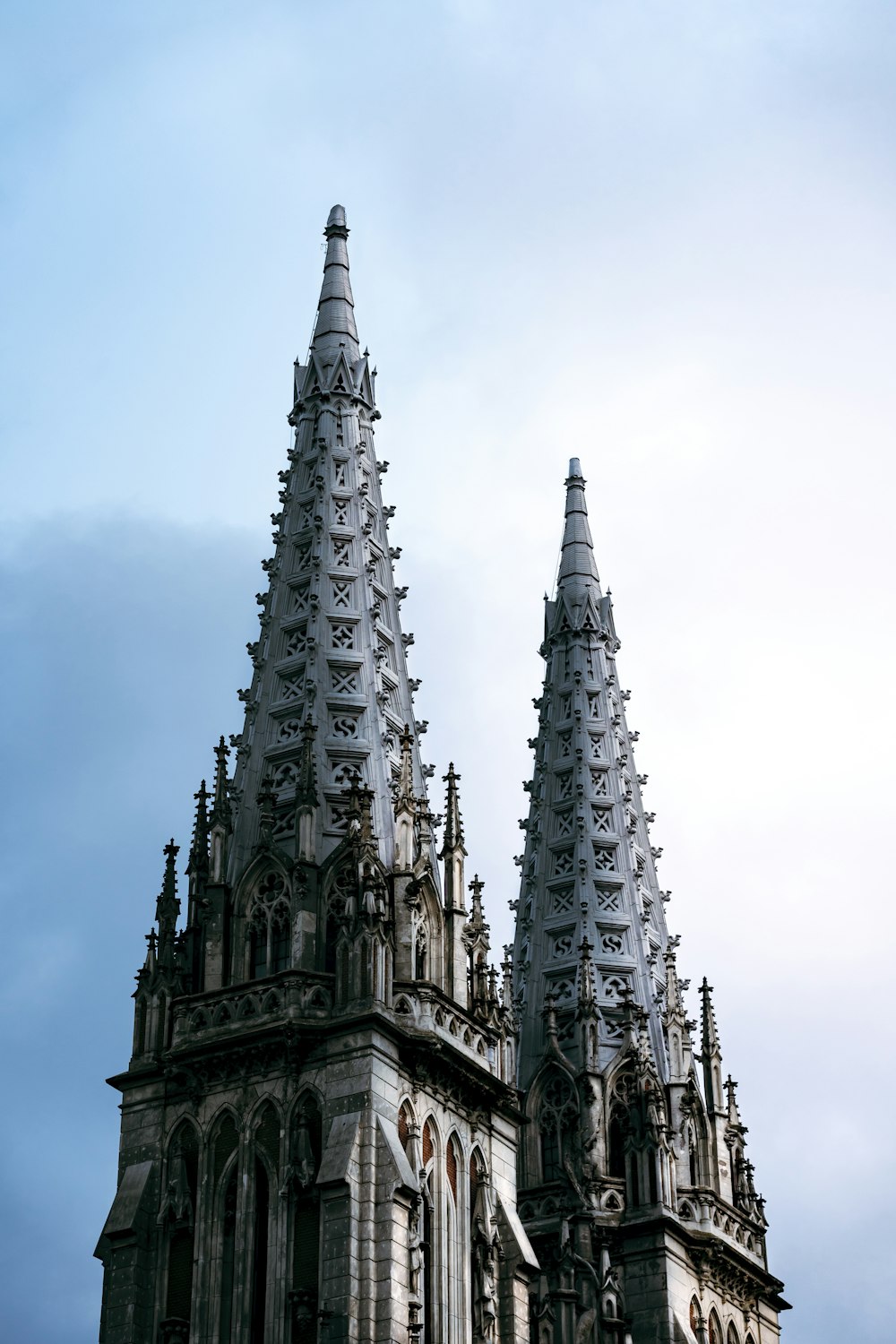 a large tall tower with a clock at the top of a building