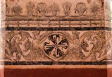 a painting on a wall with a cross on it