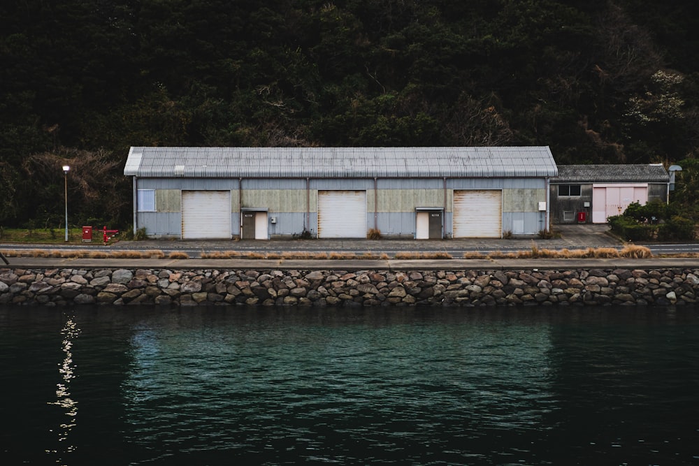 a building sitting next to a body of water