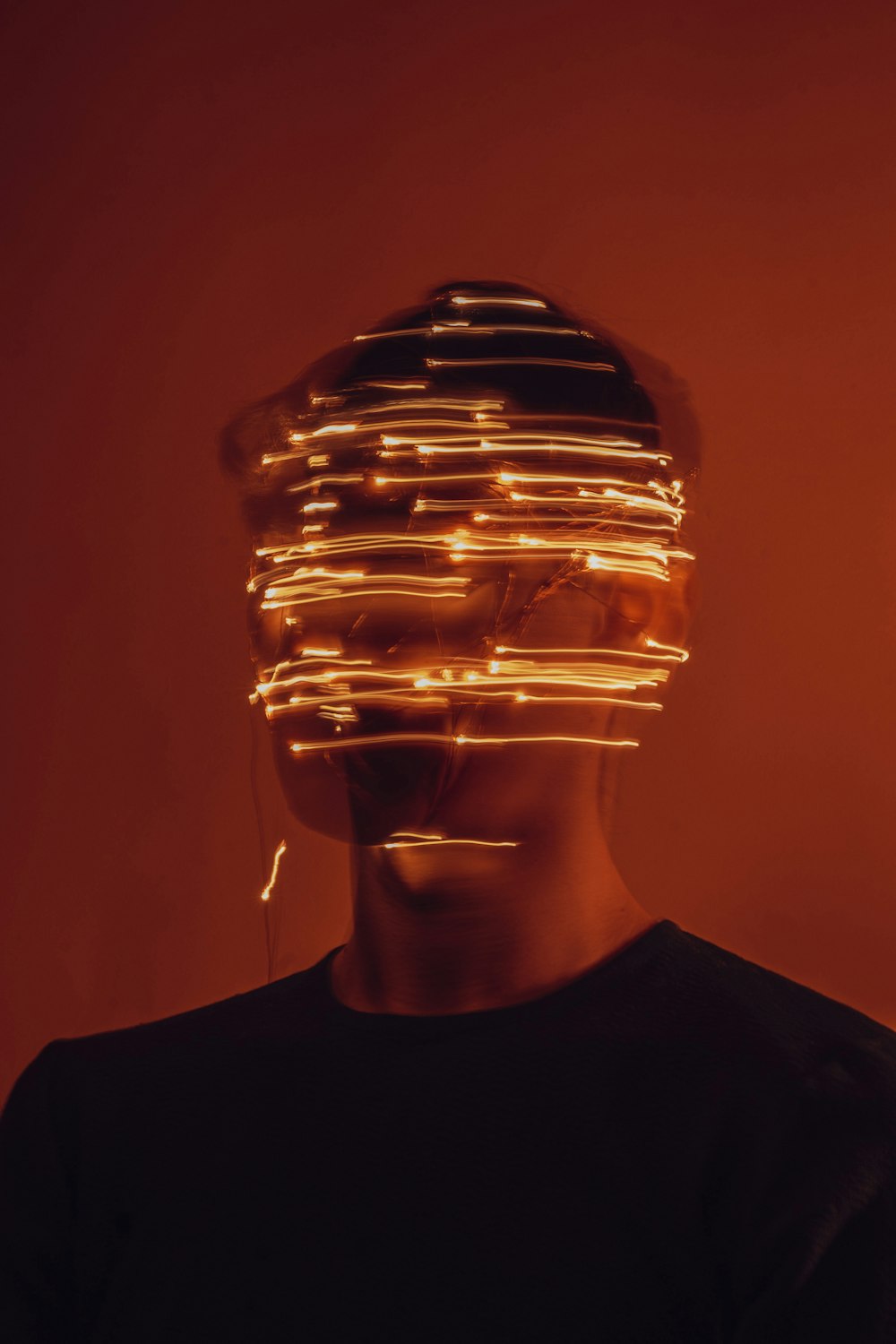a man wearing a hat made of lights