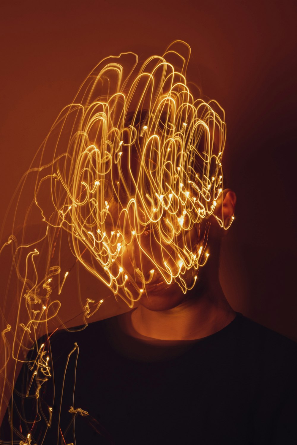 a man with a string of lights on his head