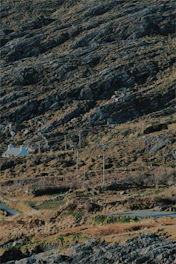 A rugged yet refined frontier landscape with a modern ranch house symbolizing stability and trust.