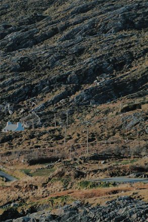 A rugged yet refined frontier landscape with a modern ranch house symbolizing stability and trust.