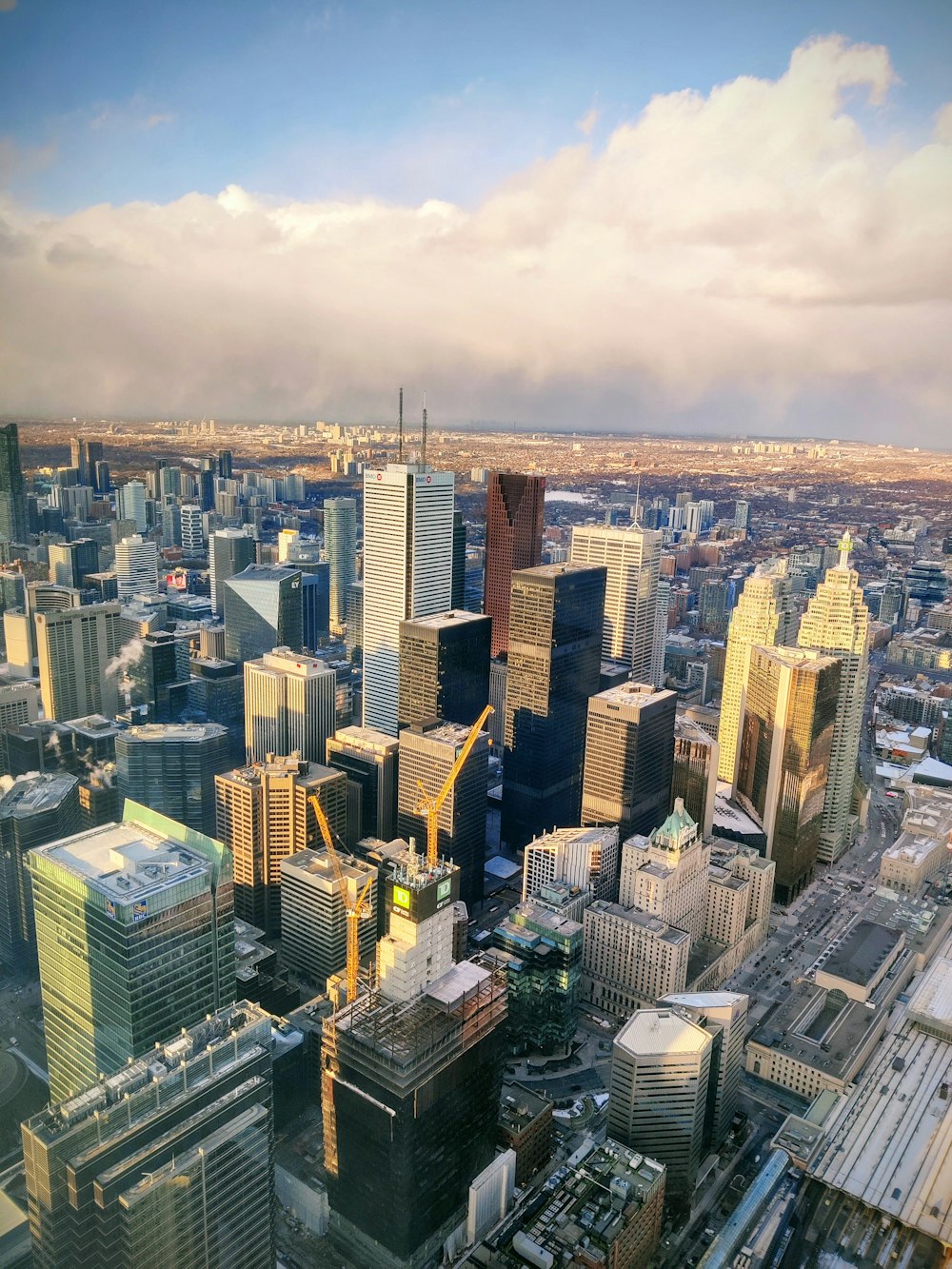 an aerial view of a city with tall buildings