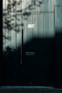 a black door with a number on it
