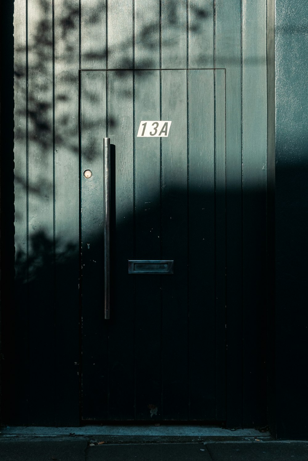 a black door with a number on it