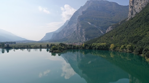 A serene lake reflecting the mountains, inviting viewers to connect with nature.