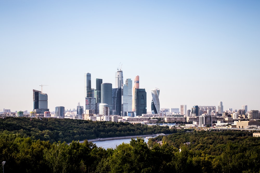 a view of a city with a river in the foreground