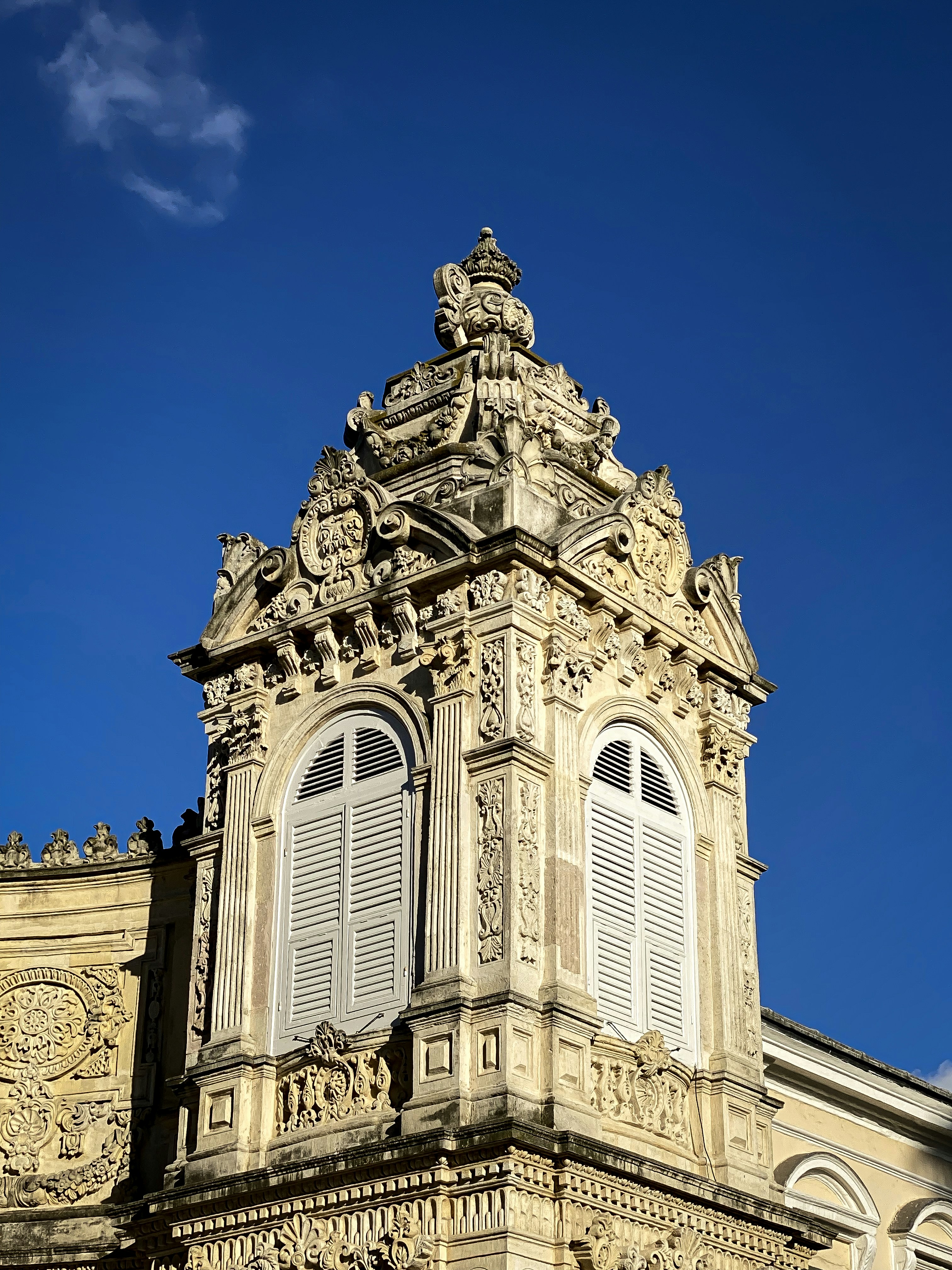 a tall building with a clock on the top of it