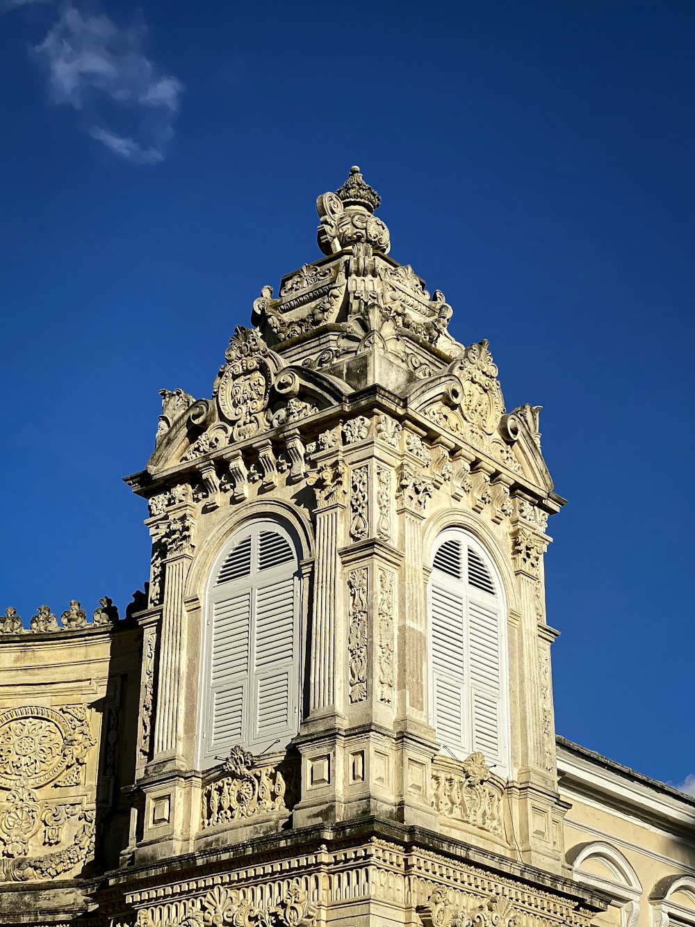 a tall building with a clock on the top of it