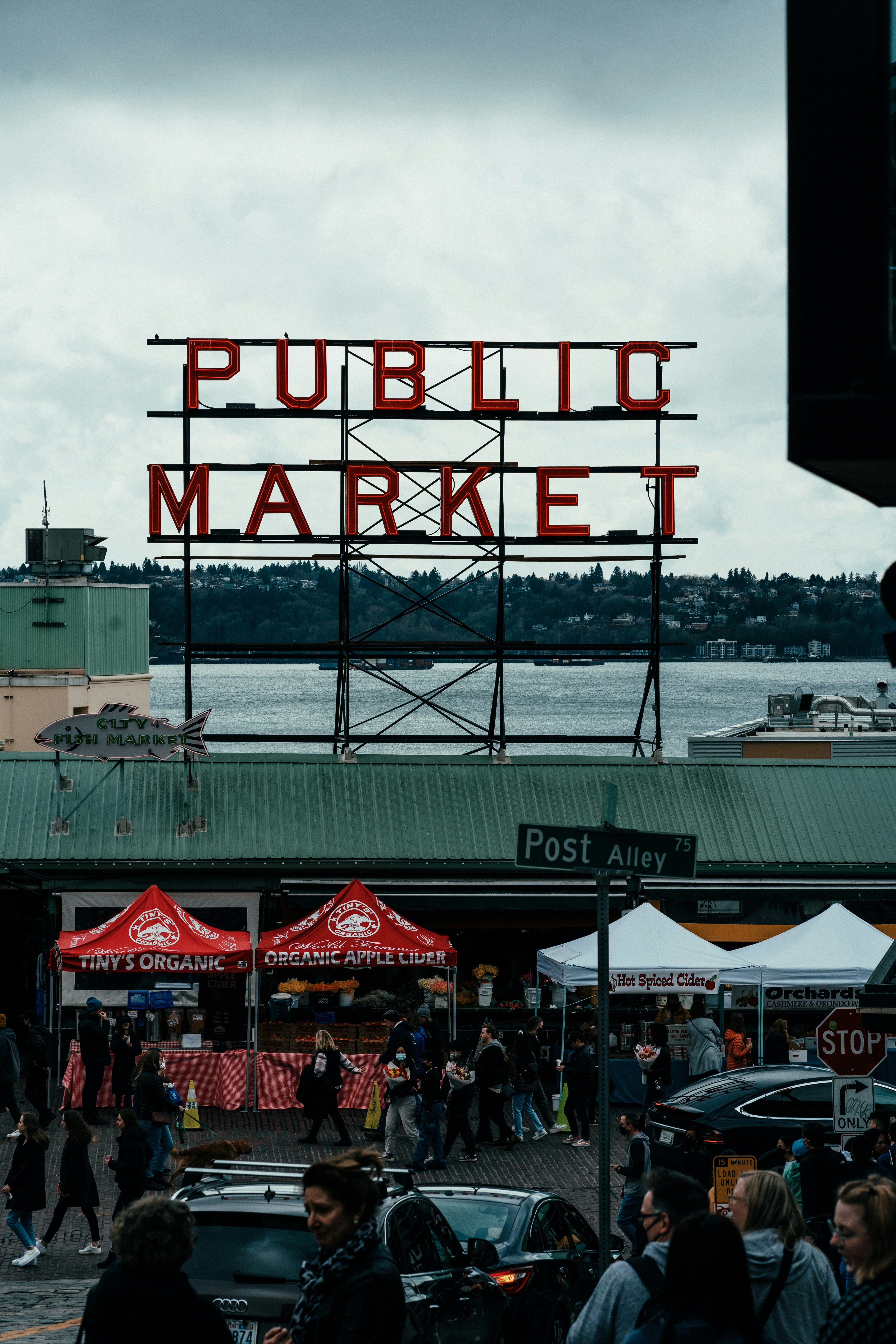 a public market with lots of people walking around