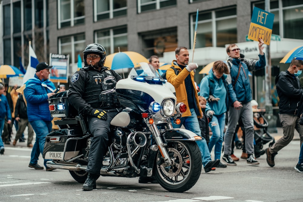 a police officer riding a motorcycle down a street