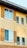 A close-up of a freshly painted building exterior.