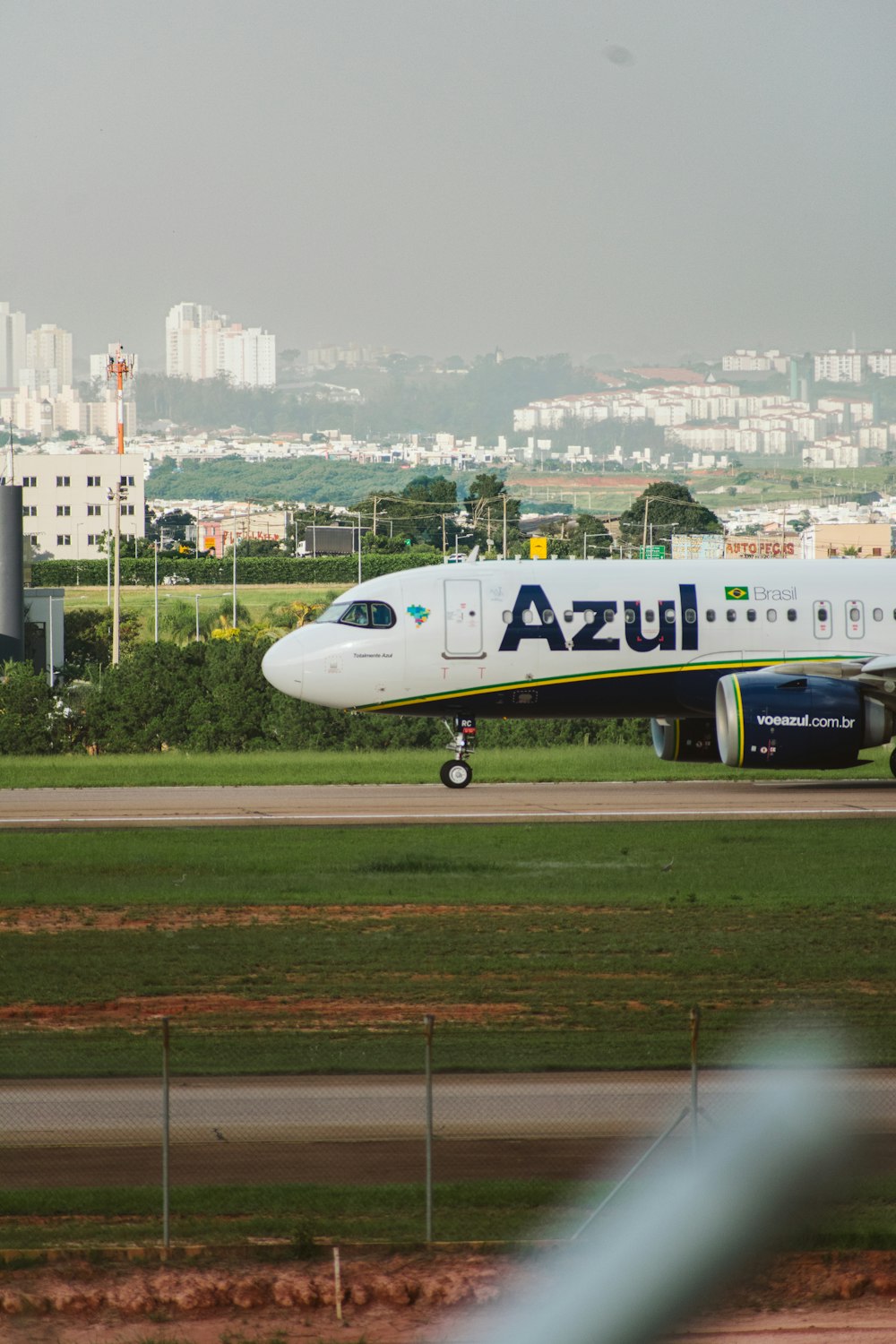 a large jetliner sitting on top of an airport runway