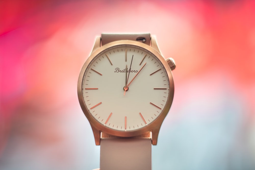 a close up of a watch on a person's wrist