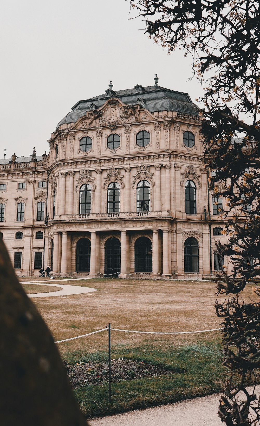 a large building with a large lawn in front of it