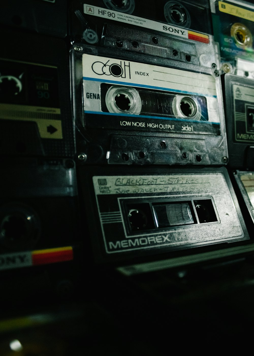 a pile of old cassettes sitting on top of each other