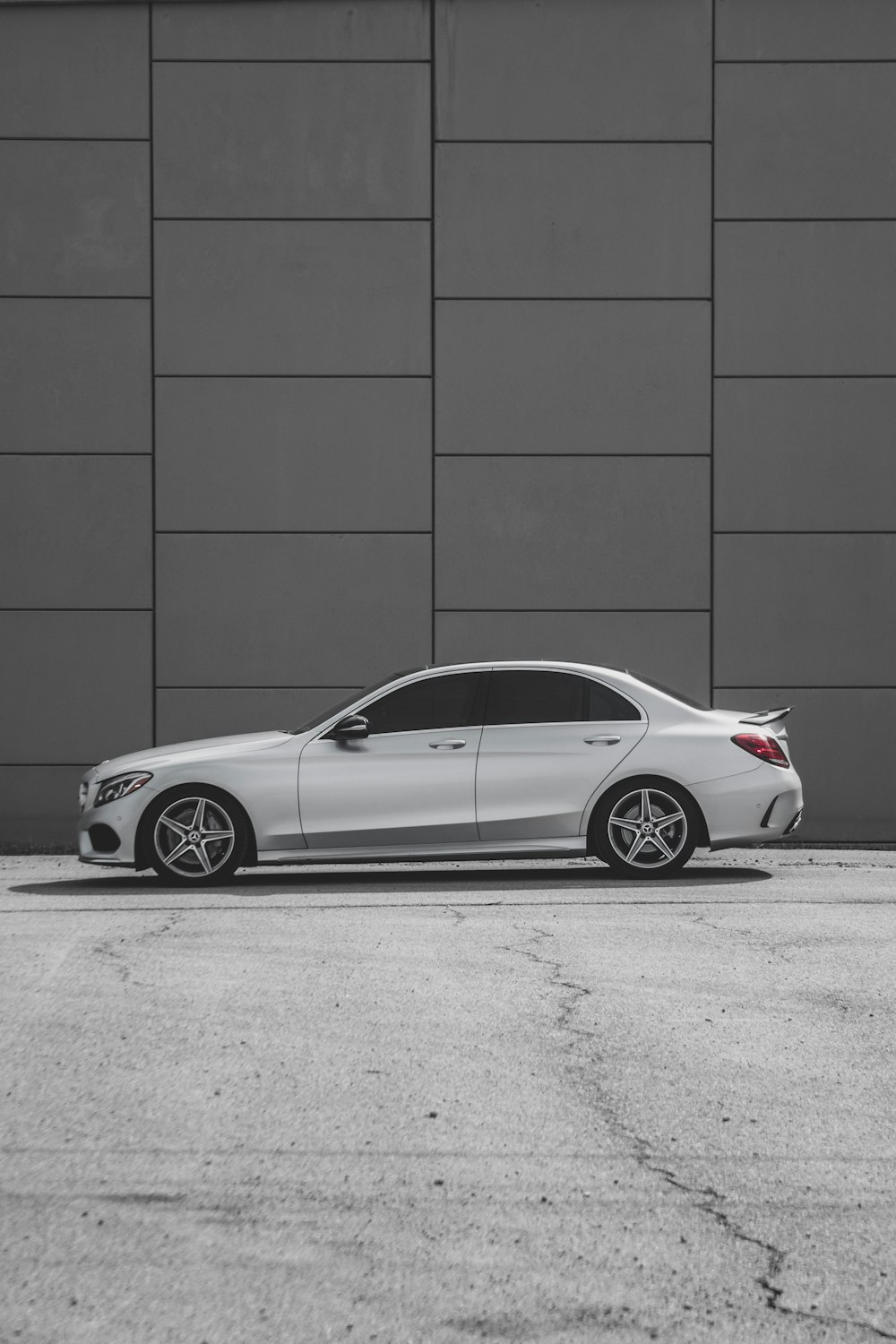 a white car parked in front of a building