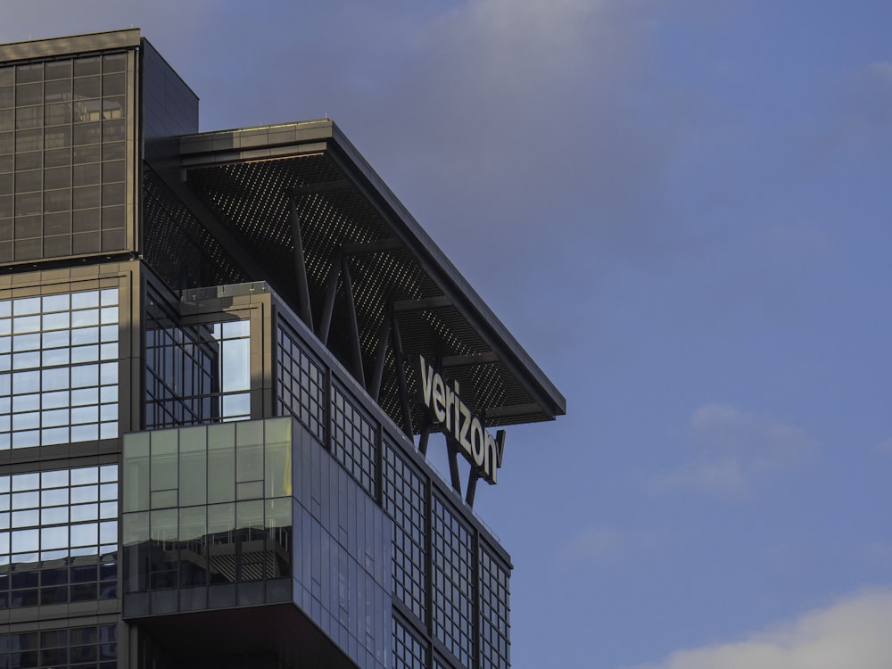 a very tall building with a sign on top of it