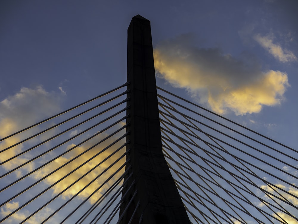 a very tall bridge with a sky background