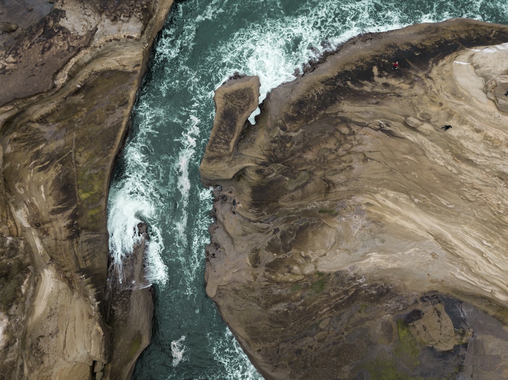 an aerial view of a river flowing through a canyon