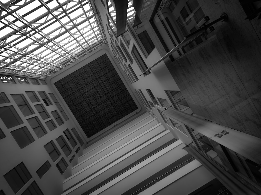 a black and white photo of a building with a skylight