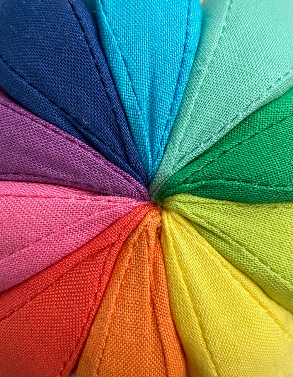 a rainbow colored umbrella with a white background