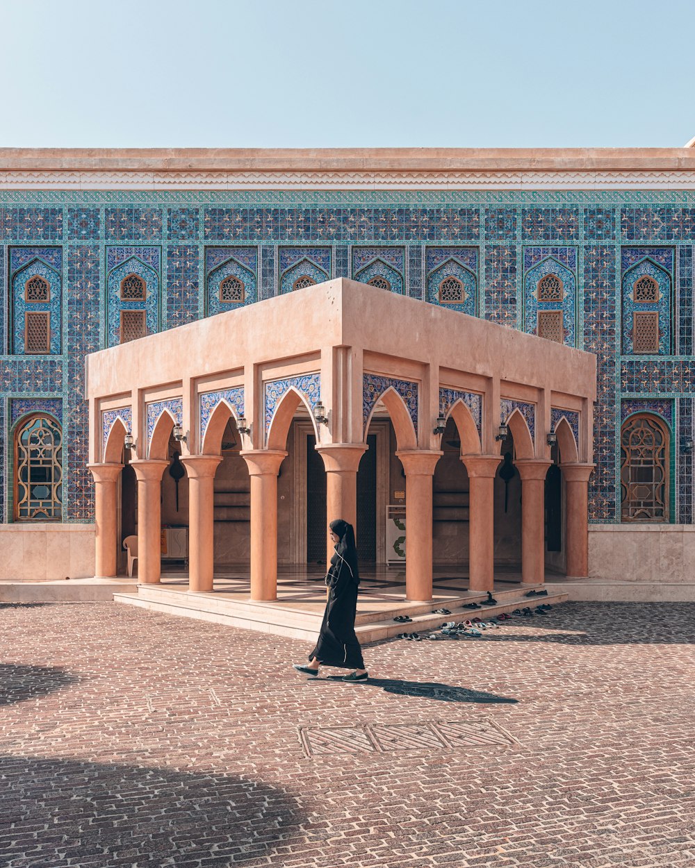 a woman standing in front of a building