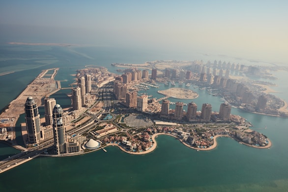 an aerial view of a city and a body of water