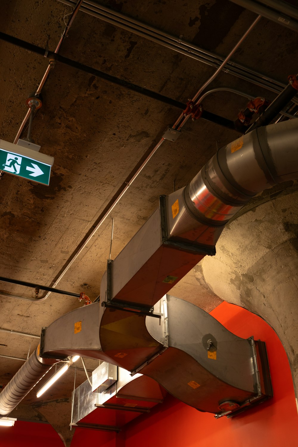 a street sign hanging from the ceiling of a building