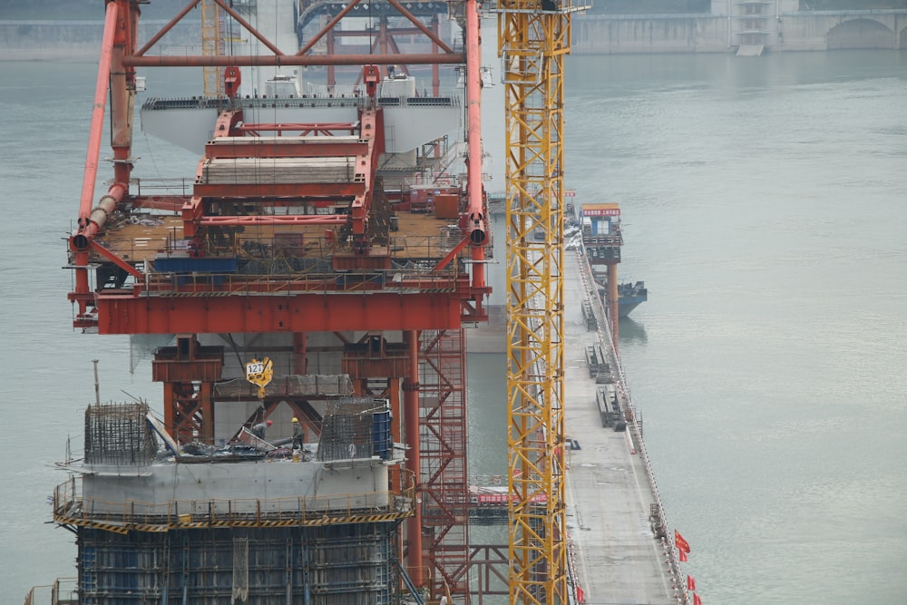 a large crane sitting on top of a large body of water