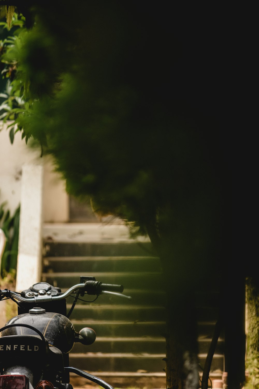 a motorcycle parked in front of a set of stairs