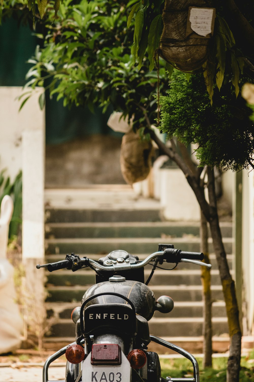 a motorcycle parked in front of a set of steps