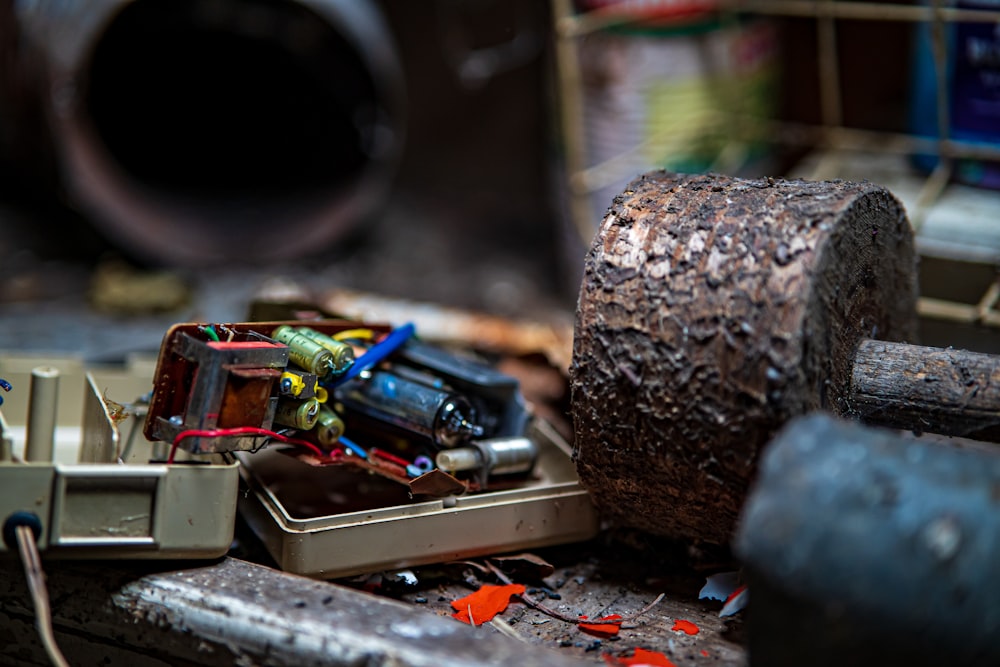 a pile of assorted electronic equipment sitting on top of a table