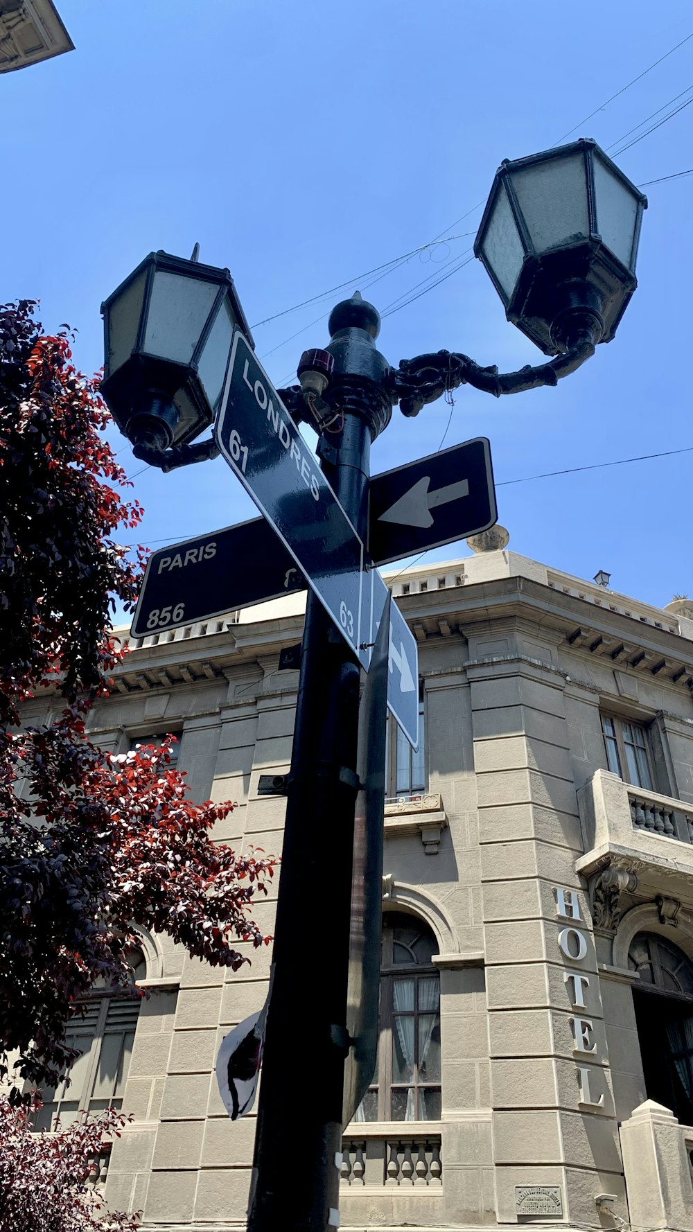 a street sign on a pole in front of a building