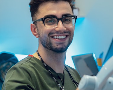 a dentist with glasses at work