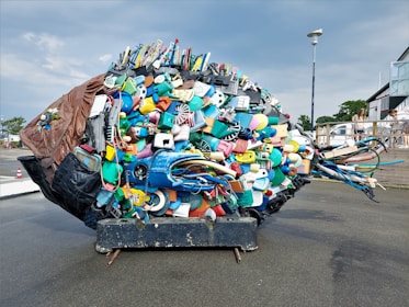 a large pile of assorted items sitting on the back of a truck