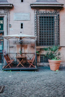 Small, inviting outdoor seating area perfect for morning coffee or evening chats.