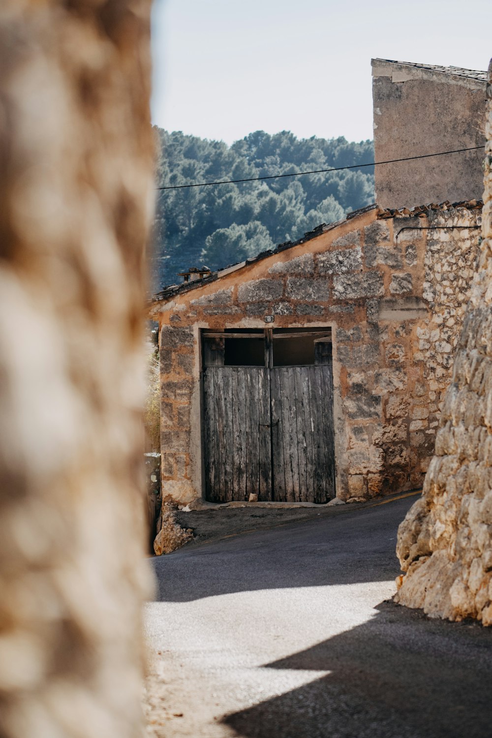 an old stone building with a wooden door