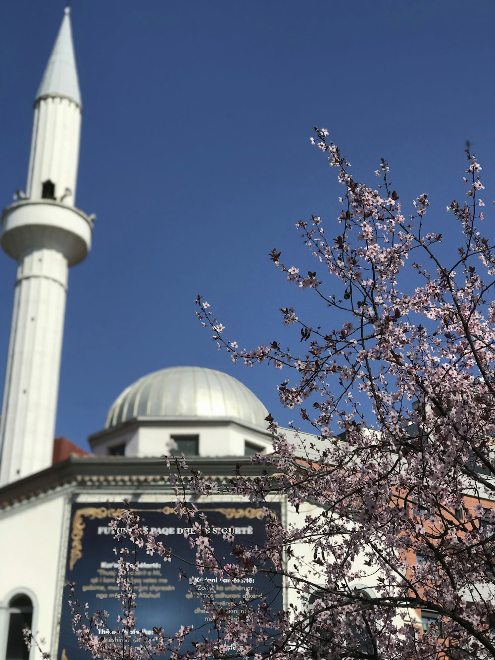 a large white building with a tall white tower