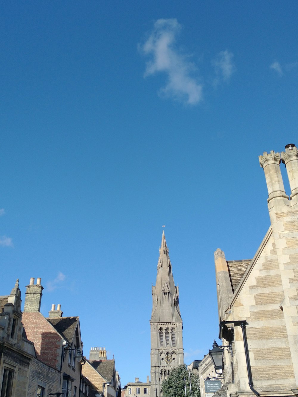 a tall clock tower towering over a city